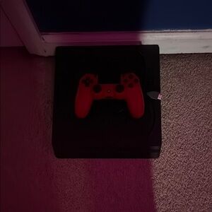 Black Gaming Console with Red Controller